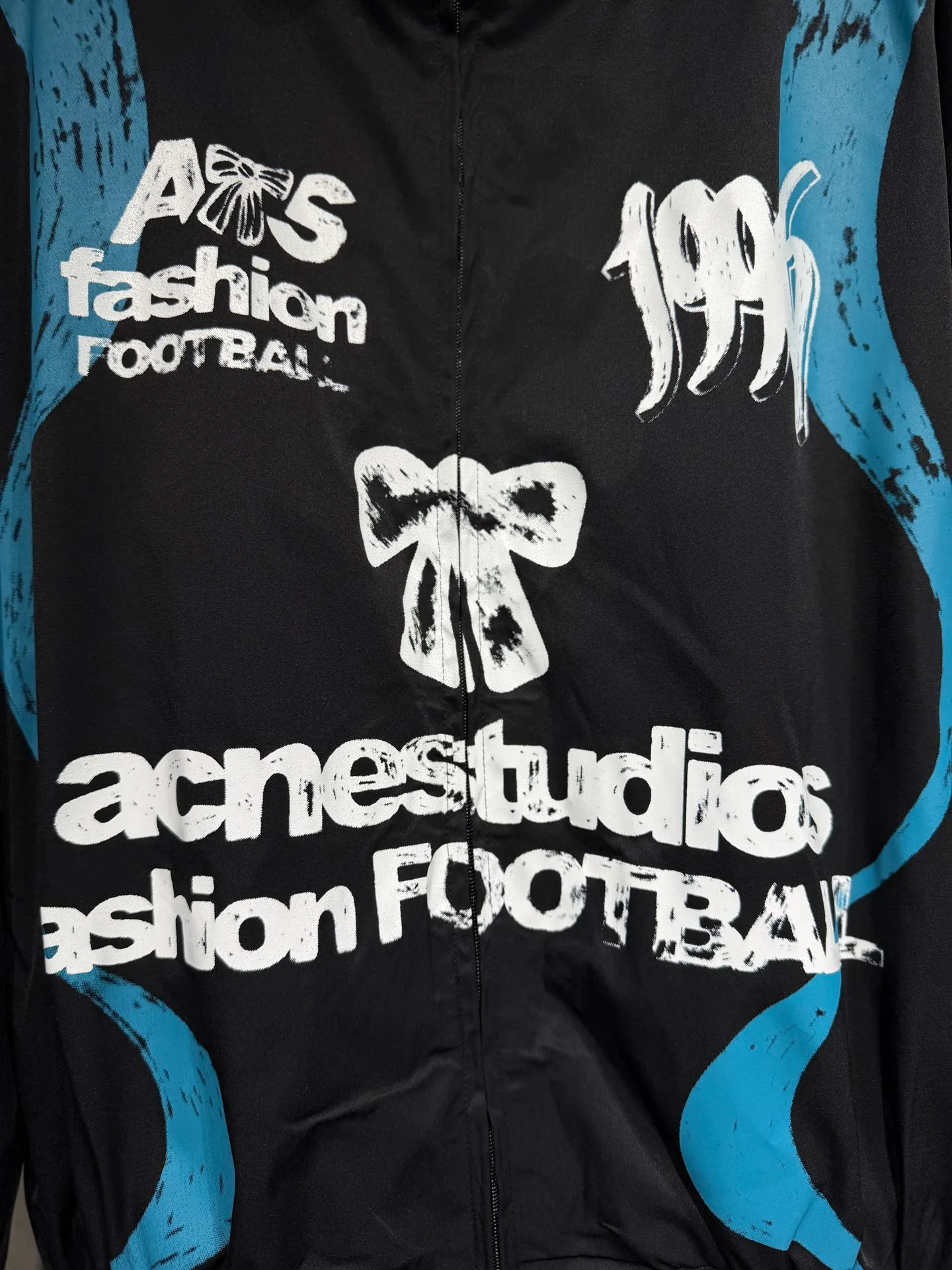 Acne studios World Cup Fashion Football Series Capsule Jacket Printed Jacket A capsule Series full of fun. Doodles, sketches and handwriting are all transformed into intentional designs. Imperfect lines and intuitive brushstrokes create a sense of reality, like a signed jersey or a message in the locker room. Each item carries a story, a memory, and a signature. Size: SML Color: Black, White
